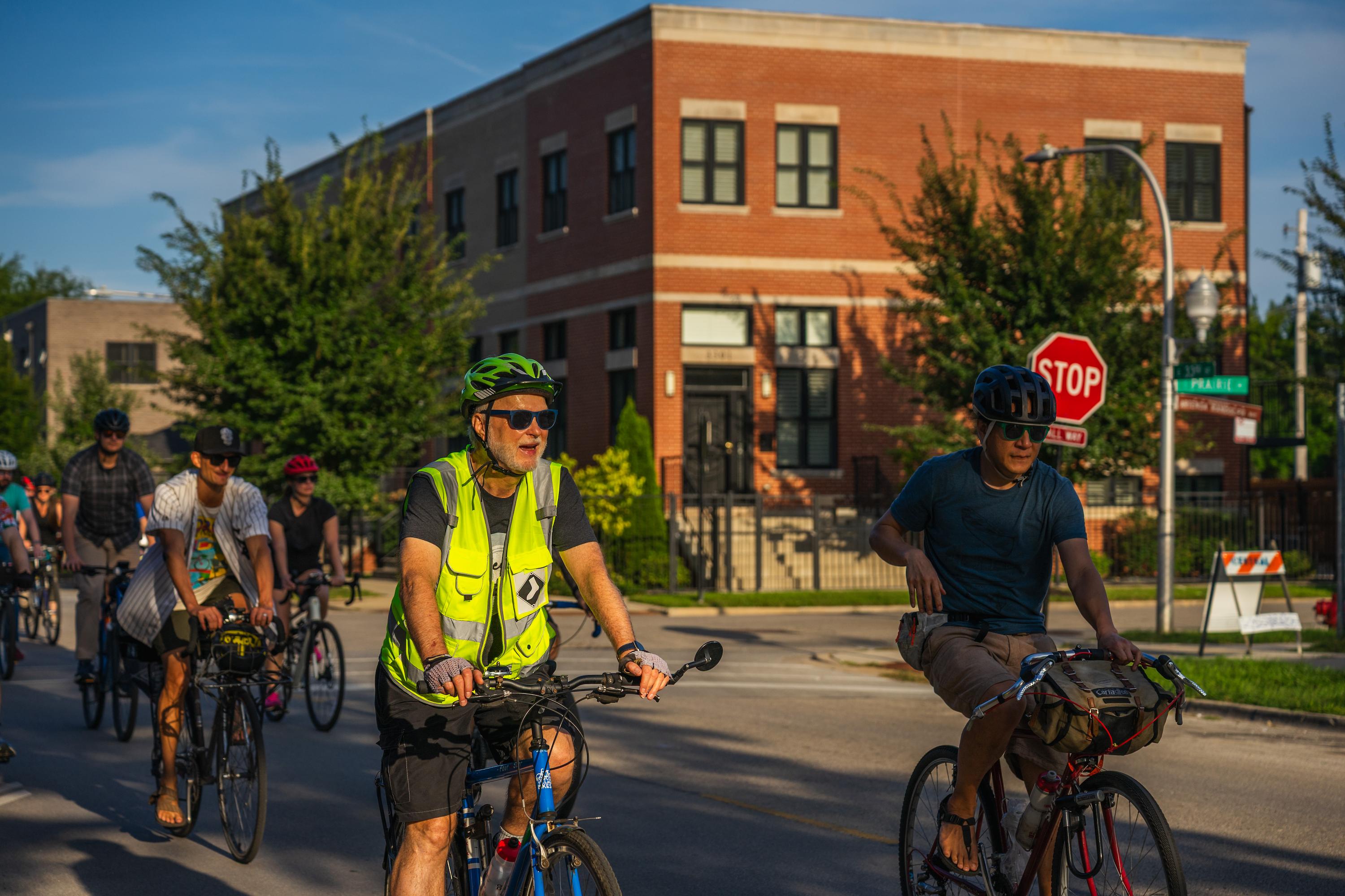 Bikers chat while riding to Rate Field. Aug 25, 2026.